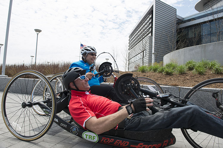 man getting on adaptive parasail