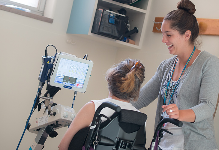 Cambridge Outpatient team member assisting patient with rehab