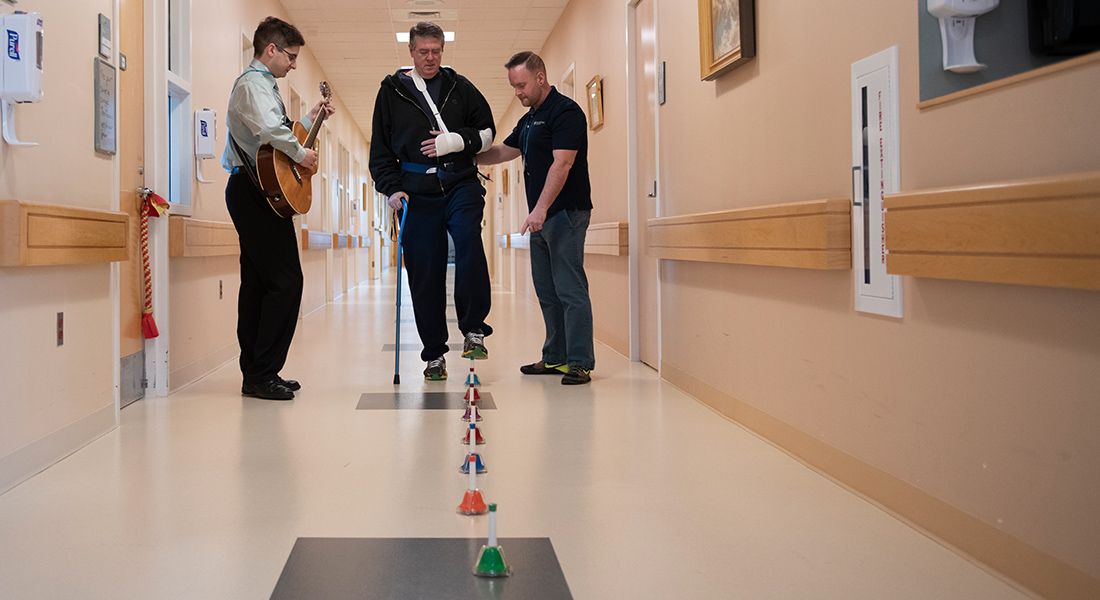 Patient rehabbing with music at Spaulding Rehabilitation Hospital Cape Cod