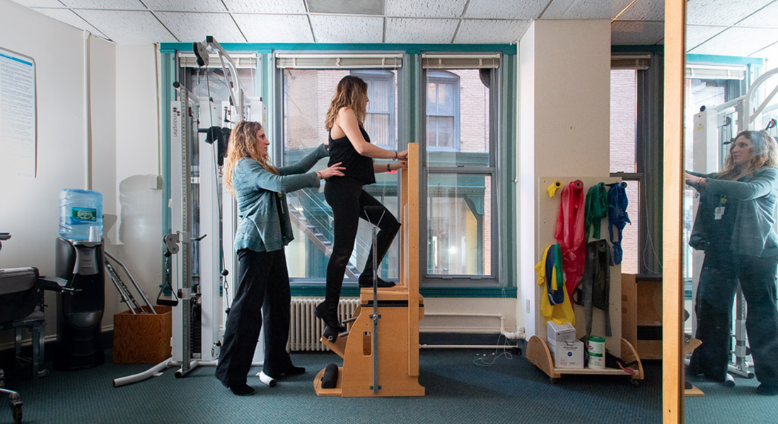 Patient rehabbing with physical therapist at Spaulding Outpatient Center Downtown Crossing
