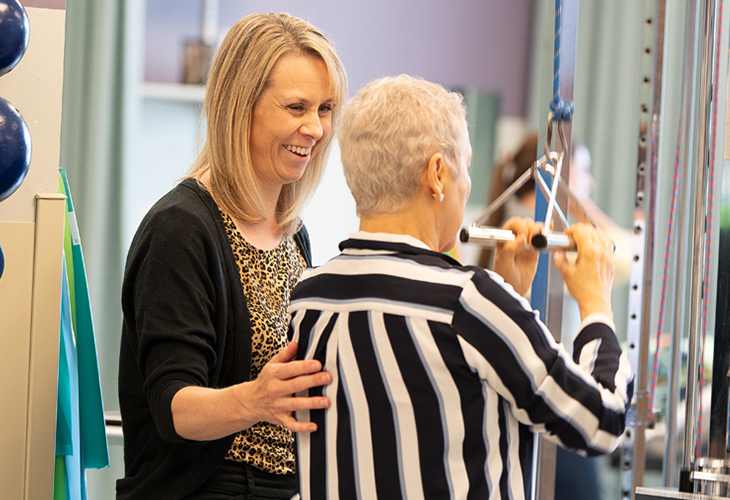Framingham Outpatient team member assisting patient with rehab