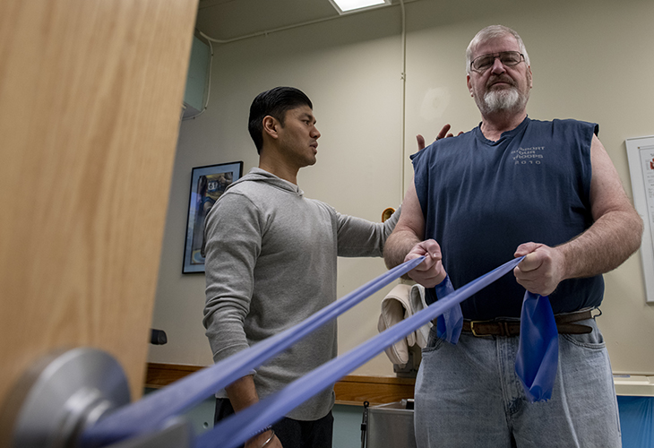 JCC Marblehead Outpatient team member assisting patient with rehab