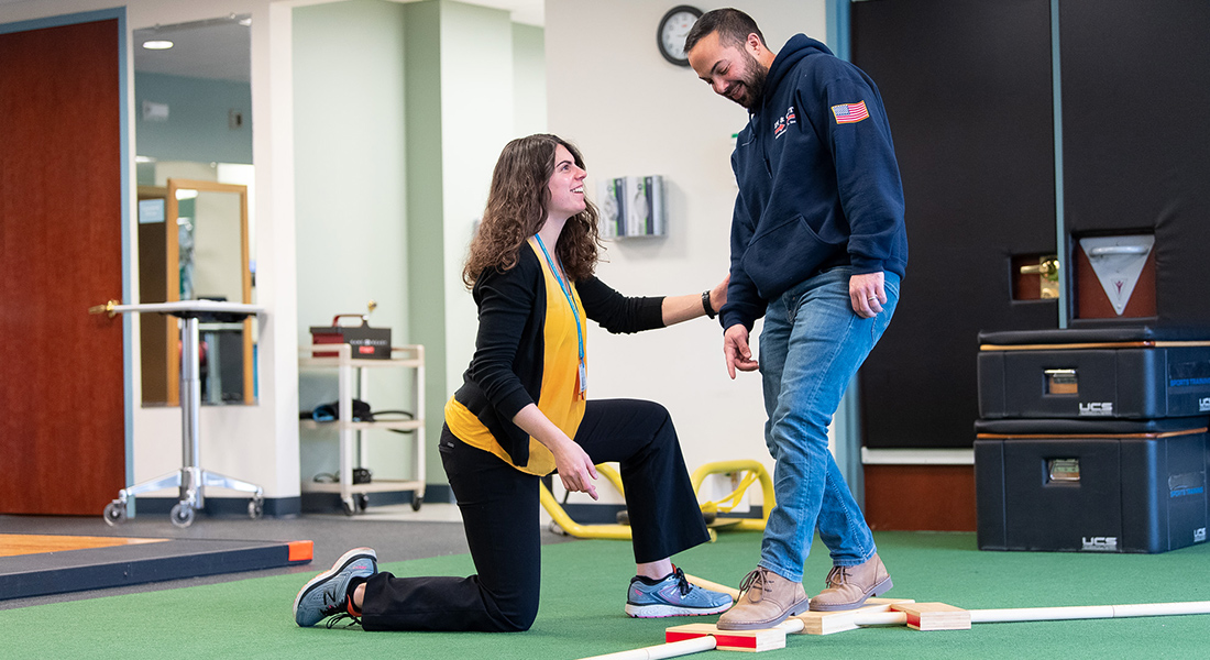 Patient rehabbing with physical therapist at Spaulding Outpatient Center Malden