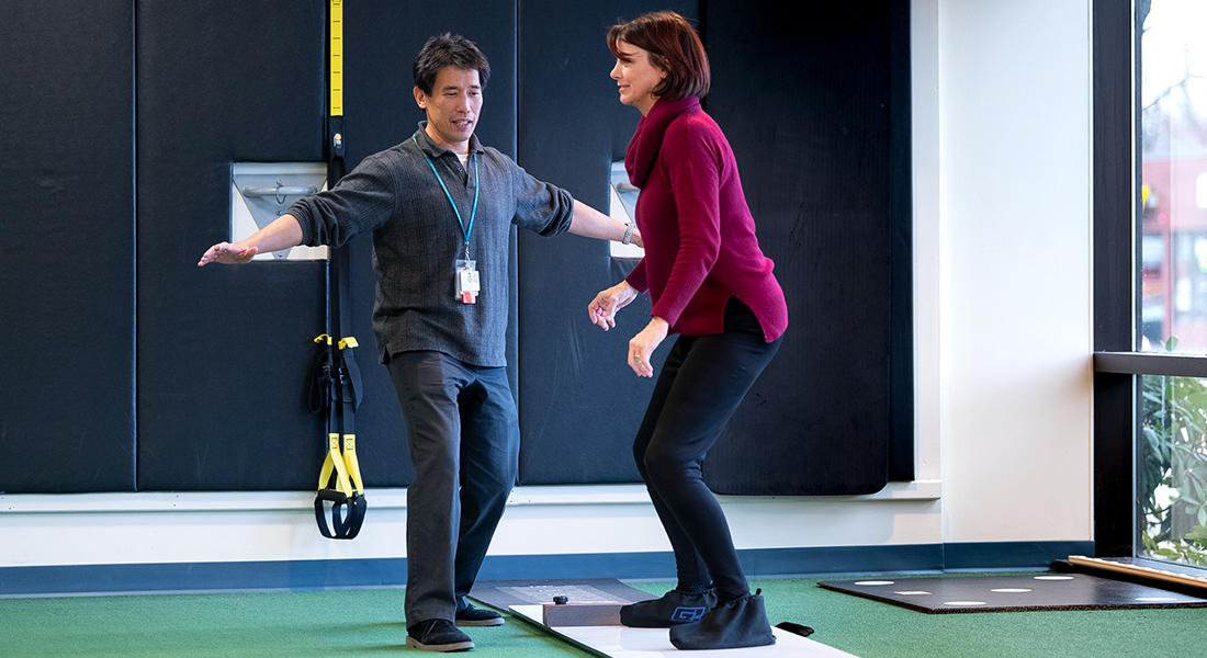 Patient rehabbing with physical therapist at Spaulding Outpatient Center Malden