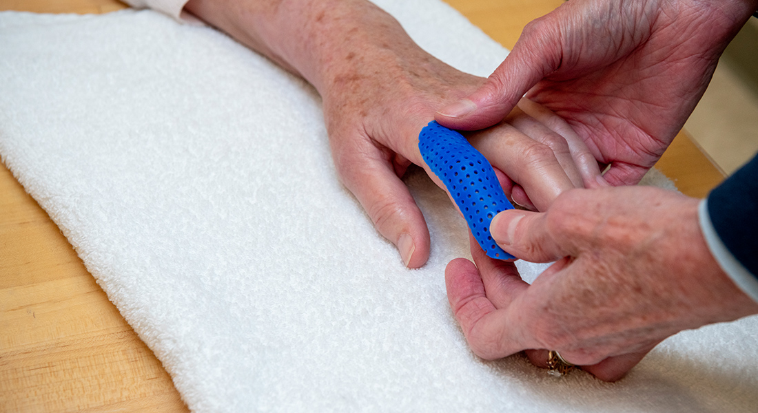 Patient's hand rehab at Spaulding Outpatient Center Orleans