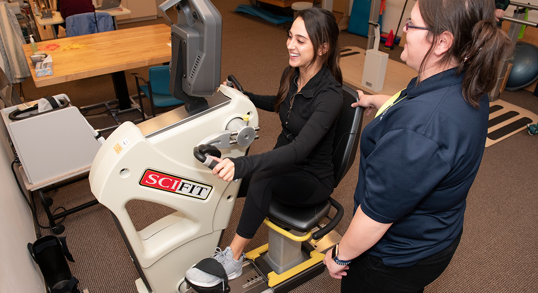 Patient rehabbing with equipment at Spaulding Outpatient Center Plymouth