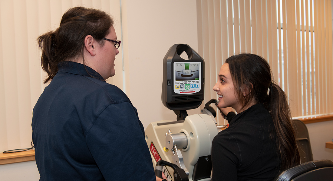 Patient rehabbing with machine at Spaulding Outpatient Center Plymouth