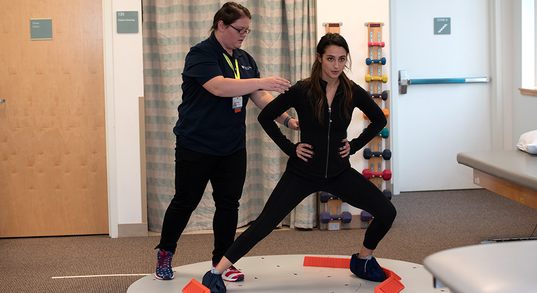 Patient rehabbing with physical therapist at Spaulding Outpatient Center Plymouth