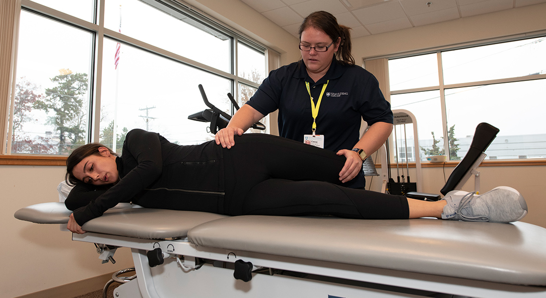 Patient receiving massage therapy at Spaulding Outpatient Center Plymouth