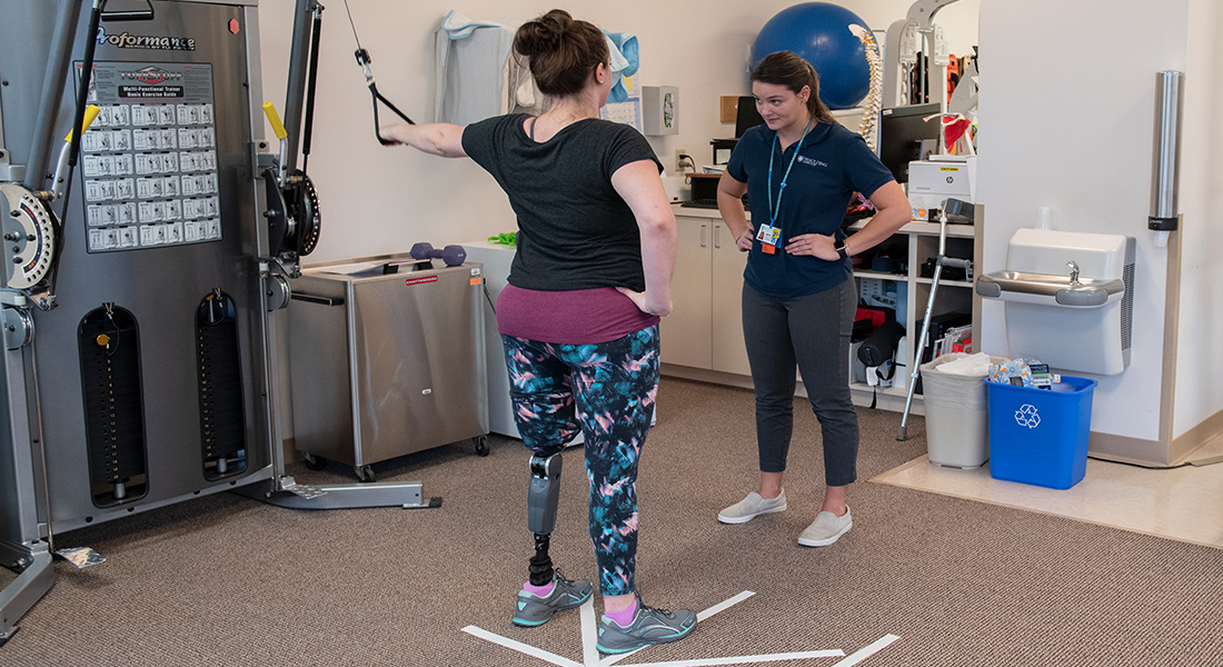 Patient with prosthetic leg rehabbing at Spaulding Outpatient Center Plymouth