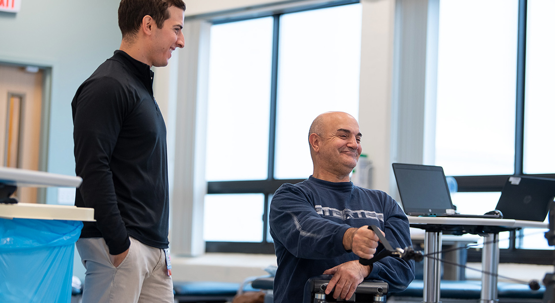 Patient using rehab equipment at Spaulding Outpatient Center Salem