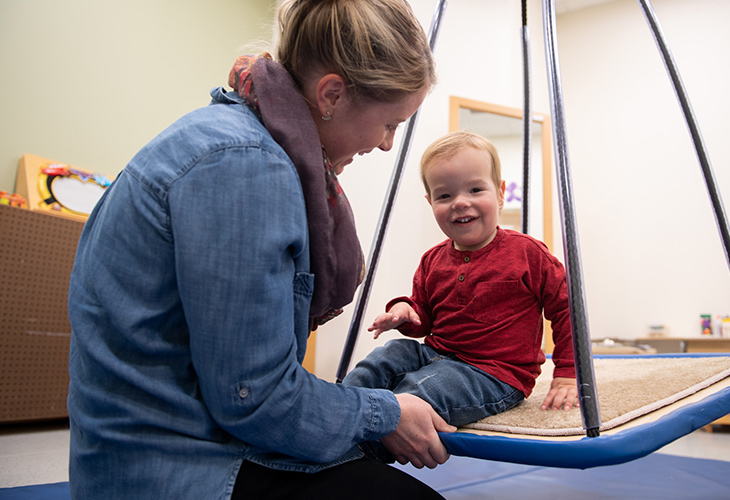 Salem Childrens Outpatient team member assisting pediatric patient with rehab
