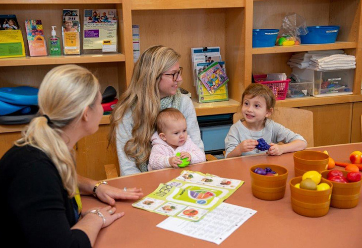 photo of patient with mother and therapist