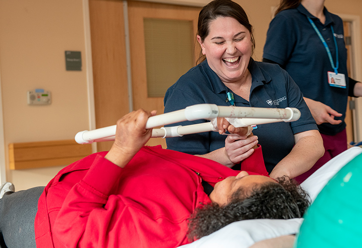 Sandwich Outpatient team member assisting patient with rehab