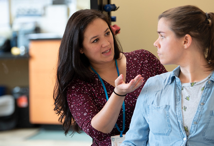 Westborough Outpatient team member assisting patient with rehab