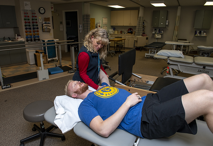 Yarmouth Outpatient team member assisting patient