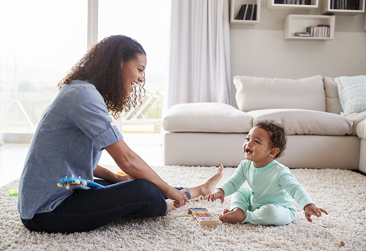 Postural control allows a child to sit in a high chair as well as step forward to kick a ball. 