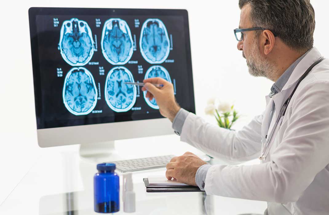 A doctor reads MRI scans.