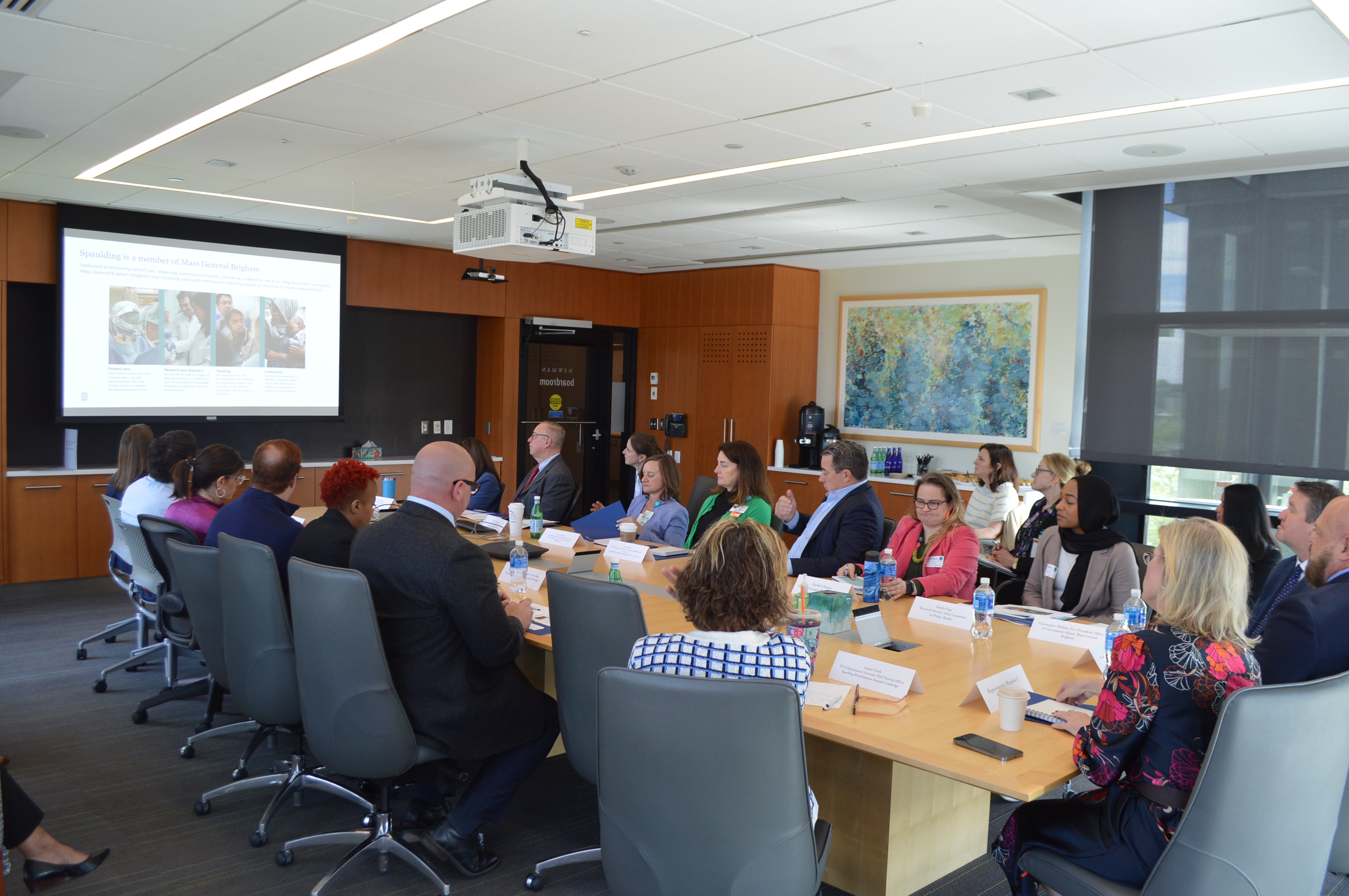 Spaulding Leadership and elected officials sitting at a conference table