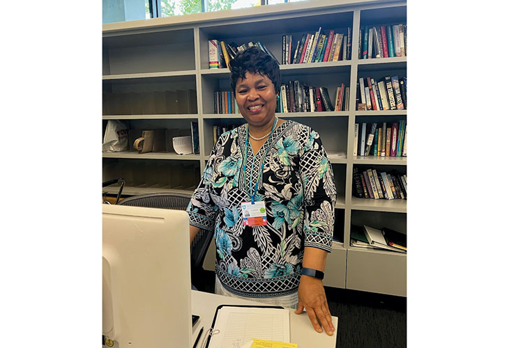 Comfort poses in the library, looking strong and healthy.