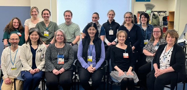 Team members posing together at the office.