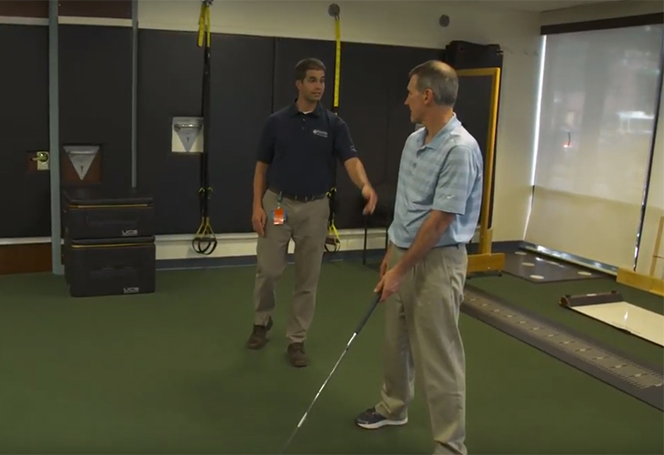 Photo of therapist and golfer